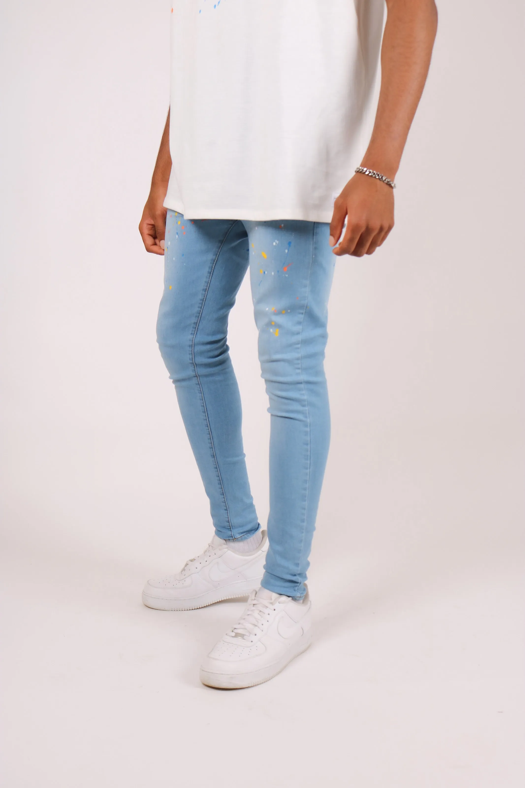 Logan Stonewash Paint Splatter Skinny Jeans